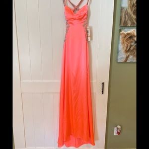 Gorgeous neon coral formal gown.
